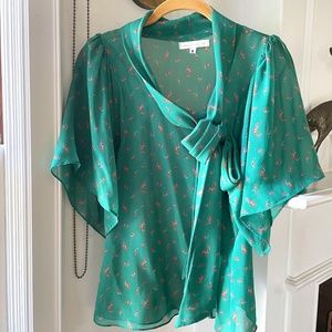 Green blouse with bow.